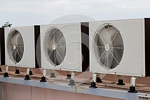 Air compressors on roof of factory