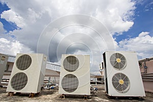 Air compressors on roof of factory