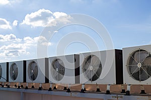 Air compressors on roof of factory