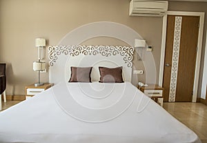 Air conditioned hotel room with single double bed. photo
