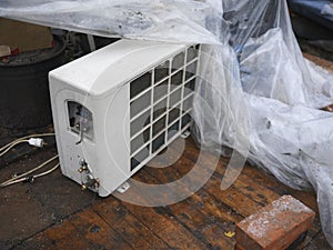 Air conditioner covered with cellophane foil