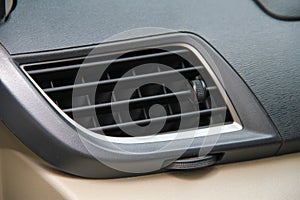 air conditioner grille on car dashboard.