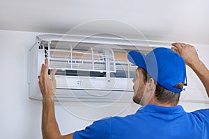 Air conditioner maintenance and repair service. hvac technician working