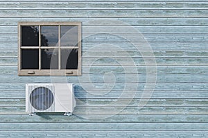 Air conditioner outdoor unit on a blue house with a window. 3d