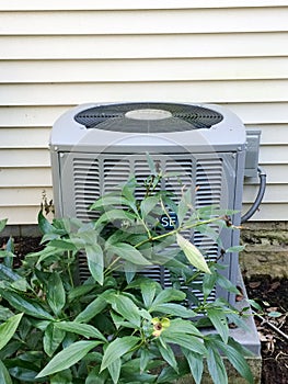 Air conditioner outdoor unit for central air with green plant