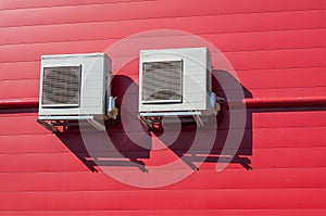 Air Conditioner on red wall background