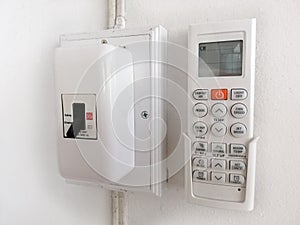 Air conditioner remote control and switch breaker on the wall