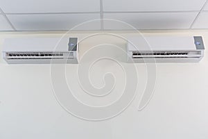 Air conditioner split type embed on wall of living room., Twin a