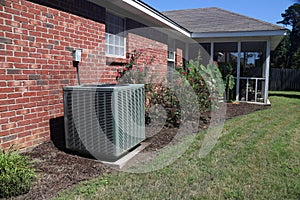 Air Conditioner system next to a home