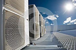 Air conditioner units with sun and blue sky