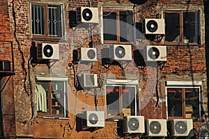 Air conditioners on the brick wall