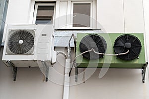 Air conditioners on wall of building outdoors