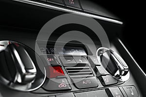 Air conditioning button inside a car. Climate control AC unit in the new car. Modern car interior details. Car detailing. Car insi