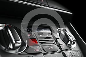 Air conditioning button inside a car. Climate control AC unit in the new car. Modern car interior details. Car detailing. Car insi photo