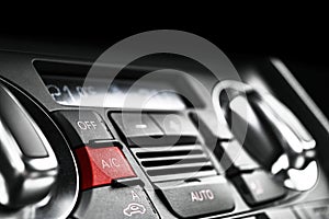 Air conditioning button inside a car. Climate control AC unit in the new car. Modern car interior details. Car detailing