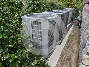 Air conditioning and heating unit for a residential house