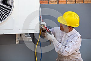 Air-conditioning installation by expert technicians in the uniform photo