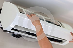 Air Conditioning Repair, Repairman fixing air conditioning system, Male technician service for repair and maintenance of air