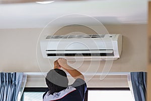 Air Conditioning Repair, Repairman ixing air conditioning system, Male technician service for repair and maintenance of air