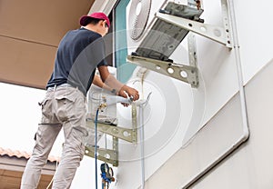 Air Conditioning Repairman checking and fixing modern air conditioning system, Technician team checking leakage air conditioning