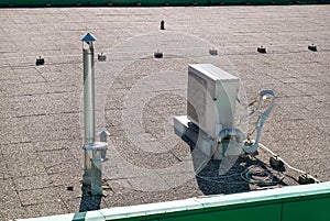 Air conditioning system assembled on top of a building / Air vents on top of commercial building / Air cooled water chillers top.