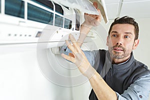 air conditioning technician looking for problem