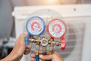 Technician is checking air conditioner