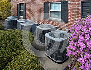 Air conditioning units outside an apartment complex