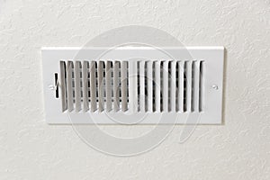 Air Conditioning Vent in Textured Wall Background With Copy Space