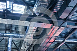 Air conditioning, ventilation ducts and heating pipes of buildings. Industrial background