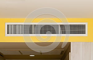 Air conditioning wall mounted ventilation system on ceiling in the white hotel room, Air conditioning grille or hole or air