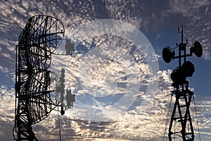 Air defense radars of military mobile anti aircraft systems, modern army industry on background beautiful clouds and sky, Russia