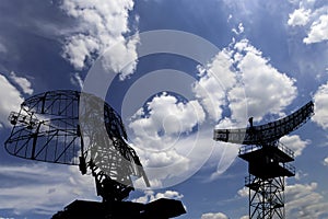 Air defense radars of military mobile anti aircraft systems, modern army industry on background beautiful clouds and sky, Russia