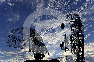 Air defense radars of military mobile anti aircraft systems, modern army industry on background beautiful clouds and sky, Russia