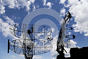 Air defense radars of military mobile anti aircraft systems, modern army industry on background beautiful clouds and sky, Russia