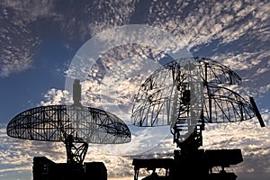 Air defense radars of military mobile anti aircraft systems, modern army industry on background beautiful clouds and sky, Russia