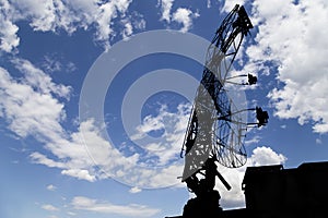 Air defense radars of military mobile anti aircraft systems, modern army industry on background beautiful clouds and sky, Russia