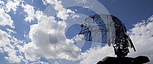 Air defense radars of military mobile anti aircraft systems, modern army industry on background beautiful clouds and sky, Russia