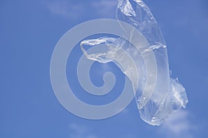 Air flying plastic bag and blue sky