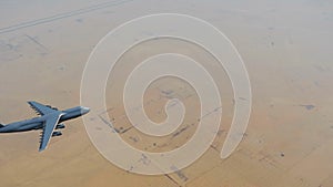 Air force cargo plane over Middle East desert 4K