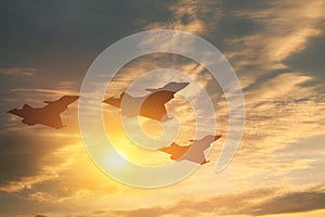 Air Force Day. Aircraft silhouettes on background of sunset.