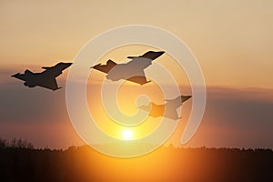 Air Force Day. Aircraft silhouettes on background of sunset.