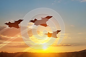 Air Force Day. Aircraft silhouettes on background of sunset.