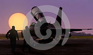 Air force jet fighter pilots silhoutte at sunset on military base airfield photo