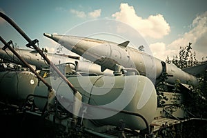 Air forces, aircraft, history, progress, development. Textured grunge old rocket launcher, blue sky background. Old