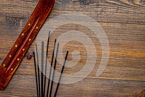 Air freshener sticks on wooden background top view mockup