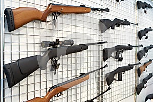 Air guns on stand in shop