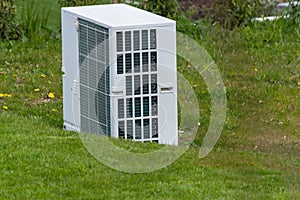 Air heat pump unit in the garden