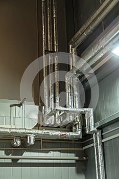 Air heating system for industrial premises, new technologies. piping on the wall