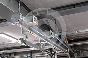 Air heating system for industrial premises, new technologies. Ventilation pipes on the ceiling